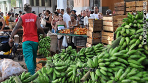 Cubans line up to buy farm food at a market in Havana May 2.