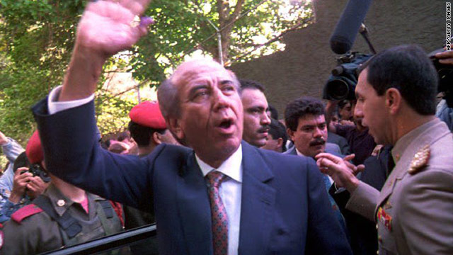 Former Venezuelan President Carlos Andres Perez waves to supporters on December 6, 1992, just 10 days after a bloody military coup led by current president Hugo Chavez failed to topple the government.