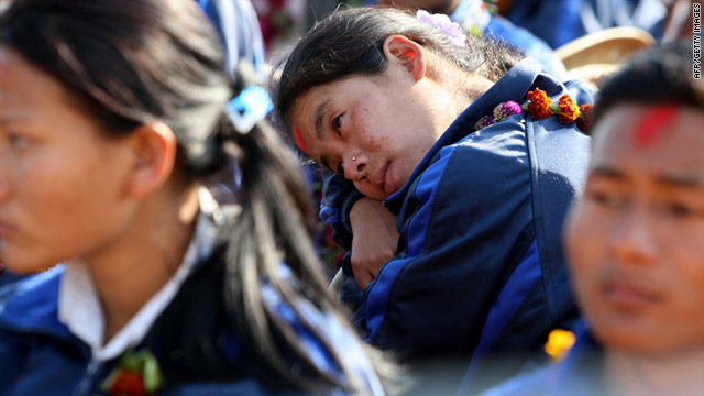 Former child soldiers take part in a farewell ceremony at a Maoist camp in eastern Nepal, on January 7, 2010.