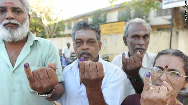 War displaced ethnic Tamils show their inked fingers after voting in Vavuniya, Sri Lanka, on Tuesday.