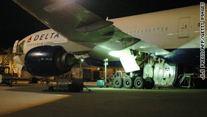 A mechanic found the body of a man in the landing gear bay of this Boeing 777 that landed in Tokyo, Japan, on Sunday.