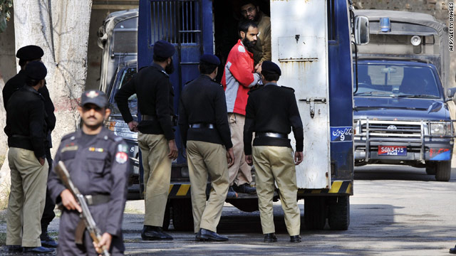 Police escort U.S. terror suspects from a prison van for a court hearing this week in Sargodha, Pakistan.