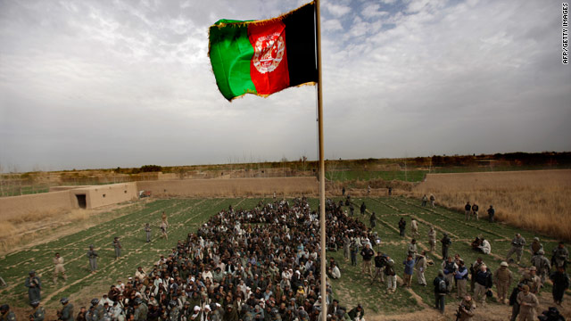 The Afghan national flag is raised during a ceremony in Marjah, Afghanistan, on Thursday.