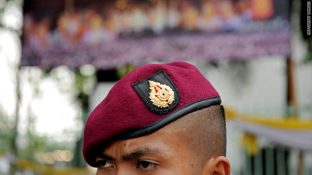 A soldier stands guard on Thursday outside Government House in Bangkok.