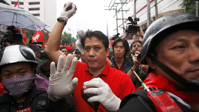 A protester holds blood in a plastic bag to be thrown during a protest near Thailand PM's Abhisit Vejjajiva's residence.
