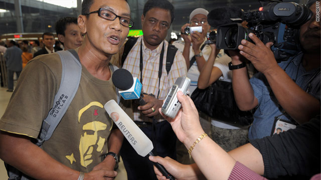 Human rights activist Zaw Lwin arrives at Bangkok airport Thursday after being released by the Myanmar authorities.