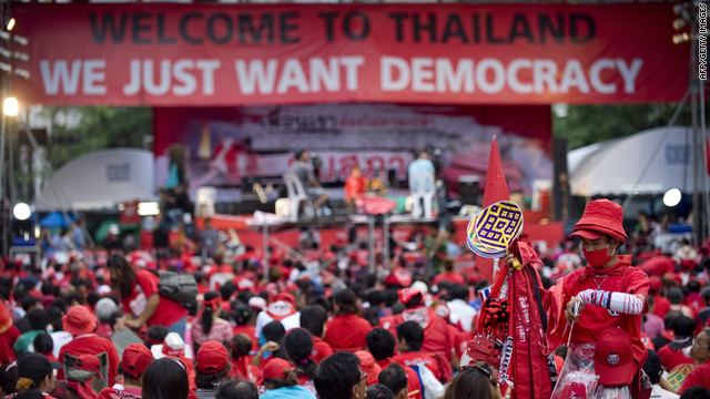 A "Red Shirt" protester sells memorabilia to others as  they take part in the ongoing anti-government rally in the main shopping  district of central Bangkok on April 18.