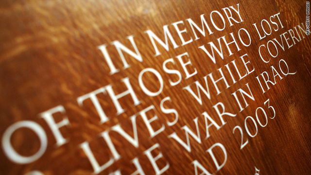 An inscription is seen on the wall next to memorials to journalists killed in conflicts in Iraq, Afghanistan, Somalia, the Balkans and many more, placed on an alter in St Bride's Church, just off Fleet Street in central London, 27 February 2007.