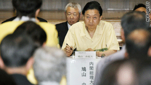 Japanese Prime Minister Yukio Hatoyama listens to residents of Okinawa on Tuesday.