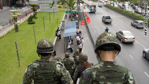 Soldiers patrol the streets around the area of the "Red Shirt" fortified camp in Bangkok on Wednesday.