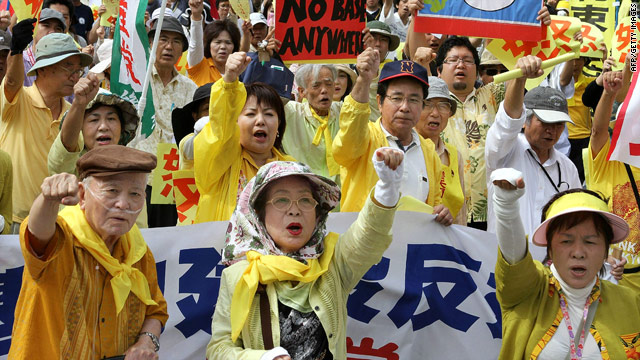 Angry Okinawans protest outside a meeting of Japanese PM Yukio Hatoyama and Governor Hirokazu Nakaima, May 23, 2010.