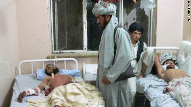 Victims of an attack on a wedding ceremony in Afghanistan's Kandahar province receive hospital treatment, June 10, 2010.