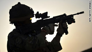 Rifleman Kesh Hurung, from Britain's Royal Gurkha Rifles, aims his weapon Thursday in Nahr e Saraj, Afghanistan.