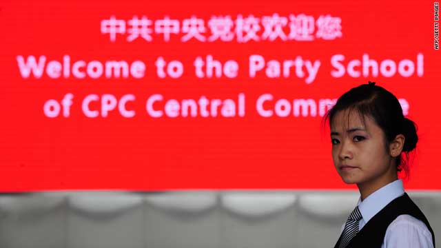 A hostess awaits the arrival of visiting journalists at the Central Party School of the Communist Party in Beijing on Wednesday.
