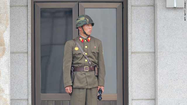 A North Korean soldier looks at the truce village of Panmunjom in the demilitarized zone (DMZ) on Wednesday.
