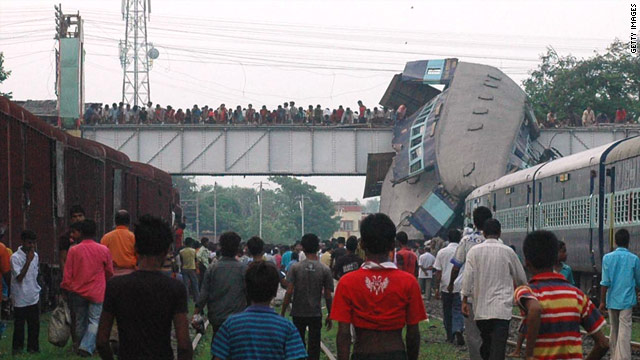 Rescuers are trying to pull out trapped passengers from mangled 
cars.