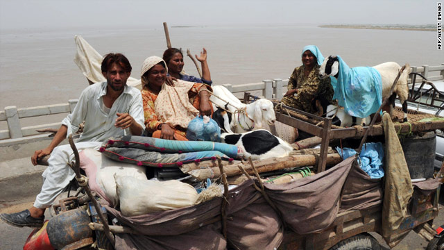 Villagers evacuate Thursday in Pakistan's Sindh province, as water levels rise, and more rain is likely for the flood-ravaged nation.