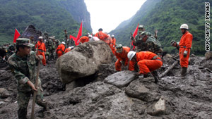 Chinese rescuers try to reach possible survivors in southwest China's Yunnan province on August 19, 2010.