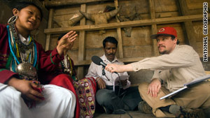 Linguist Gregory Anderson, right, makes one of the first recordings of the "hidden" language Koro.