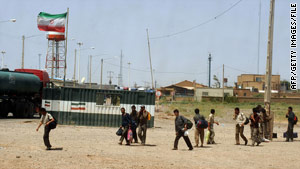 The Iranian flag flies over the the country's border with Afghanistan.