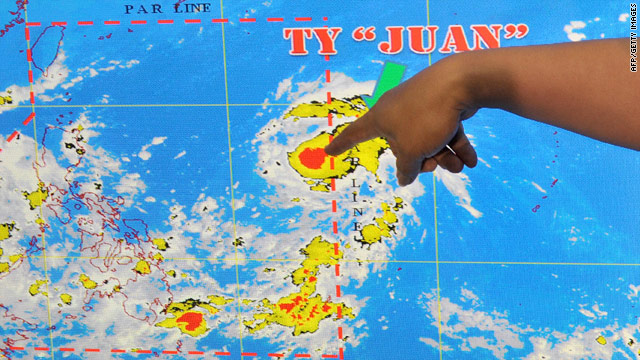 A meteorologist points to a satellite image of Typhoon Megi, known locally as Juan, in Manila on October 16.