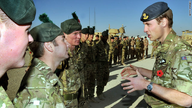 Prince William (right) talks to members of the Royal Irish Regiment before a Remembrance Day ceremony at Camp Bastion.