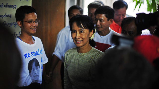 Aung San Suu Kyi arrives at the National League for Democracy HQ in Yangon on Monday -- she is calling for dialogue.