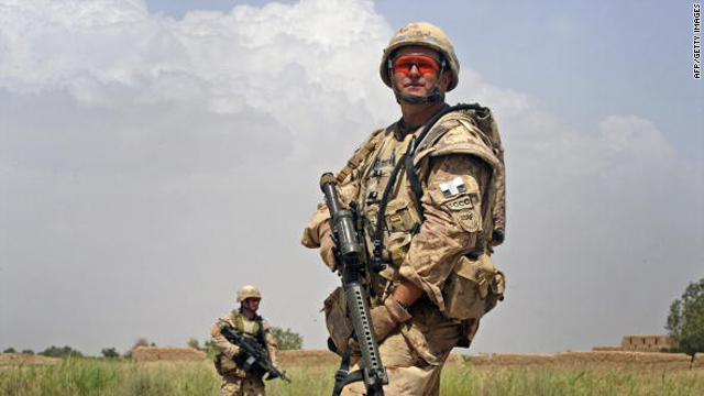 Canadian soldiers patrol in Belanday village, Dand district in Kandahar on May 17, 2010.