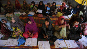 Afghani girls attend school on the outskirts of Kabul.