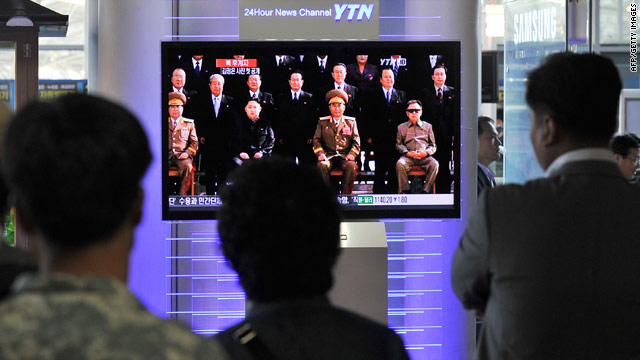 South Koreans watch a broadcast of a photo that includes Kim Jong Un, Kim Jong-Il's son, released by KCNA in September.
