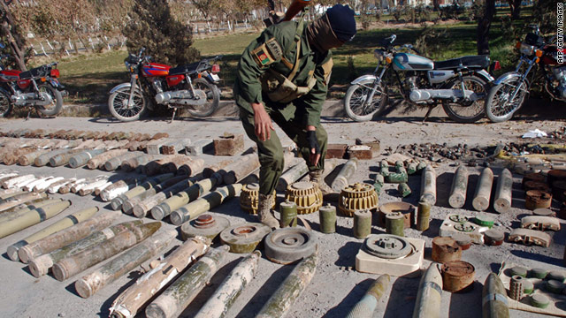 A member of Afghan security forces inspects weapons seized in an operation east of Afghanistan on November 29.