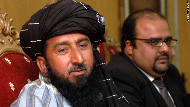 A Pakistani tribesman Kareem Khan, left, announces his intentions at a press conference with his lawyer Mirza Shehzad Akbar in Islamabad on November 29, 2010.