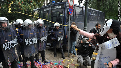 Greek workers strike over wage cuts
