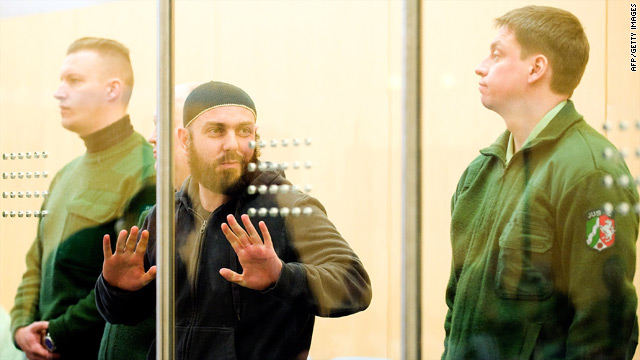 Adem Yilmez gestures during the trial in Dusseldorf, Germany.