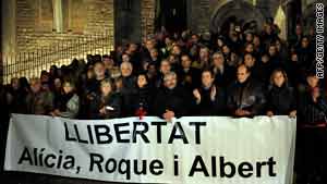 Fellow aid workers in Spain protest to demand the release of their three colleagues in December.