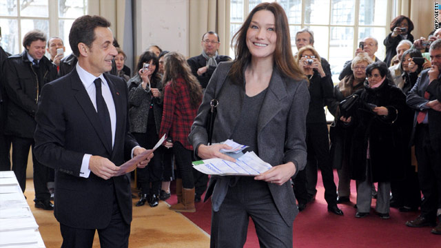 French President Nicolas Sarkozy and First Lady Carla Bruni-Sarkozy cast their votes Sunday at a Paris polling station.