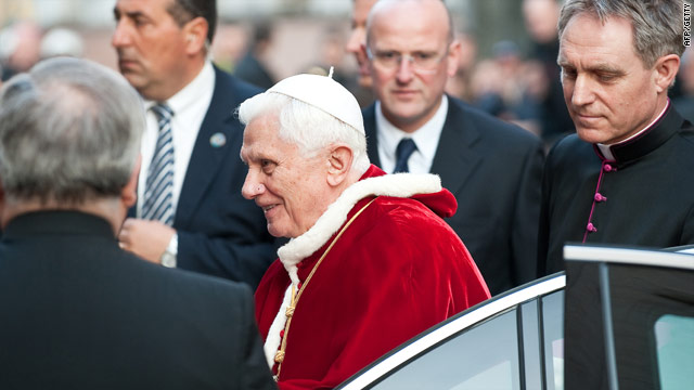 Pope Benedict XVI arrives at the Lutheran church in Rome Monday as a deepening sex abuse scandal engulfs the Vatican.