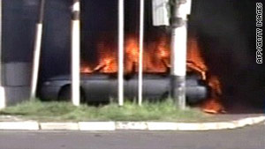 An image from Russian TV shows a burning car near a police station in Karabulak on April 5, 2010.