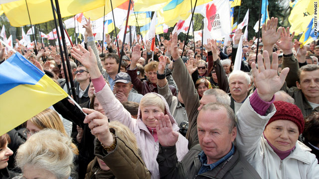 Opposition protesters wave hands at a mass meeting in front of the Ukrainian Parliament in Kiev on Saturday.