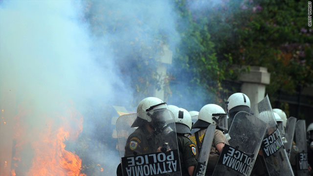 Greek riot police clash with protestors in the center of Athens on May 5.