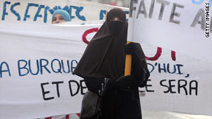 A woman in Tours, France, in February protests the movement in France to ban the full Islamic veil.