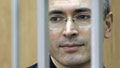 Exclusive: Billionaire hits out from cell