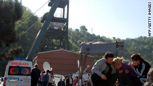 Relatives of the trapped miners wait for news near the mine in northern Turkey.