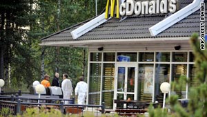 Investigators look for evidence outside a McDonald's in Porvoo, Finland, on Tuesday.