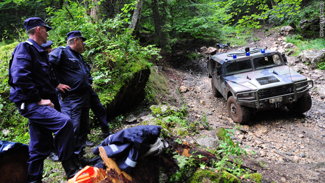 Romanian gendarmes secure the area on the Bucegi mountains on July 27, 2010 where a Israeli helicopter crashed  on the 26th.