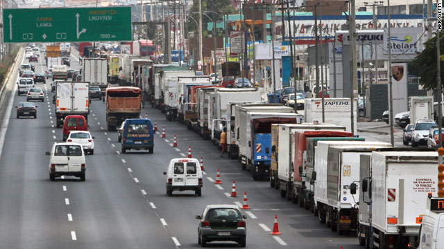 Fuel-tanker drivers block the right lane of traffic on a highway near Athens, Greece. during a protest on July 26.