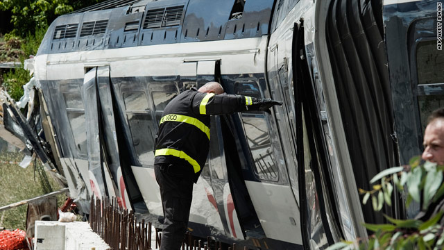 A firefighter works on the derailed train next to the central station of Naples on August 6, 2010.