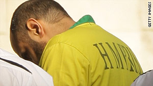 Terror suspect Babar Ahmad is escorted into the High Court by prison officers on March 18, 2009 in London.