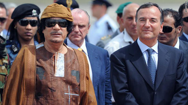 Libya's leader Moammar Gadhafi (left) next to Italy's foreign minister Franco Frattini August 29 at Ciampino airport, Italy.
