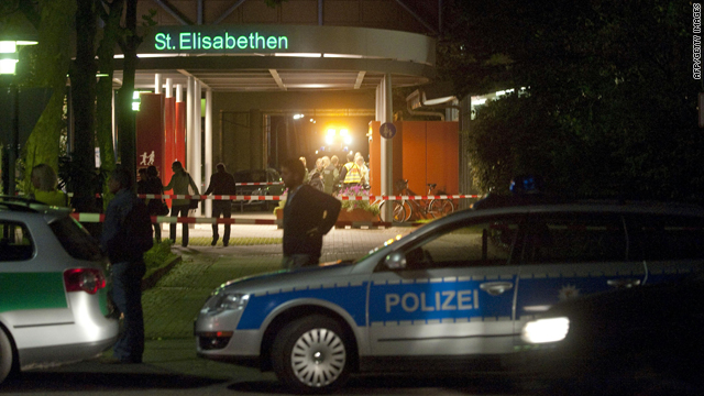 Police and fire brigade vehicles park in front of the St. Elisabethen hospital in Loerrach, Germany, on Sunday.